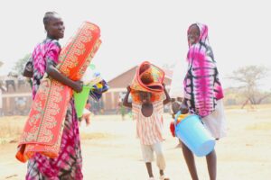 Family happy to receive essential items.